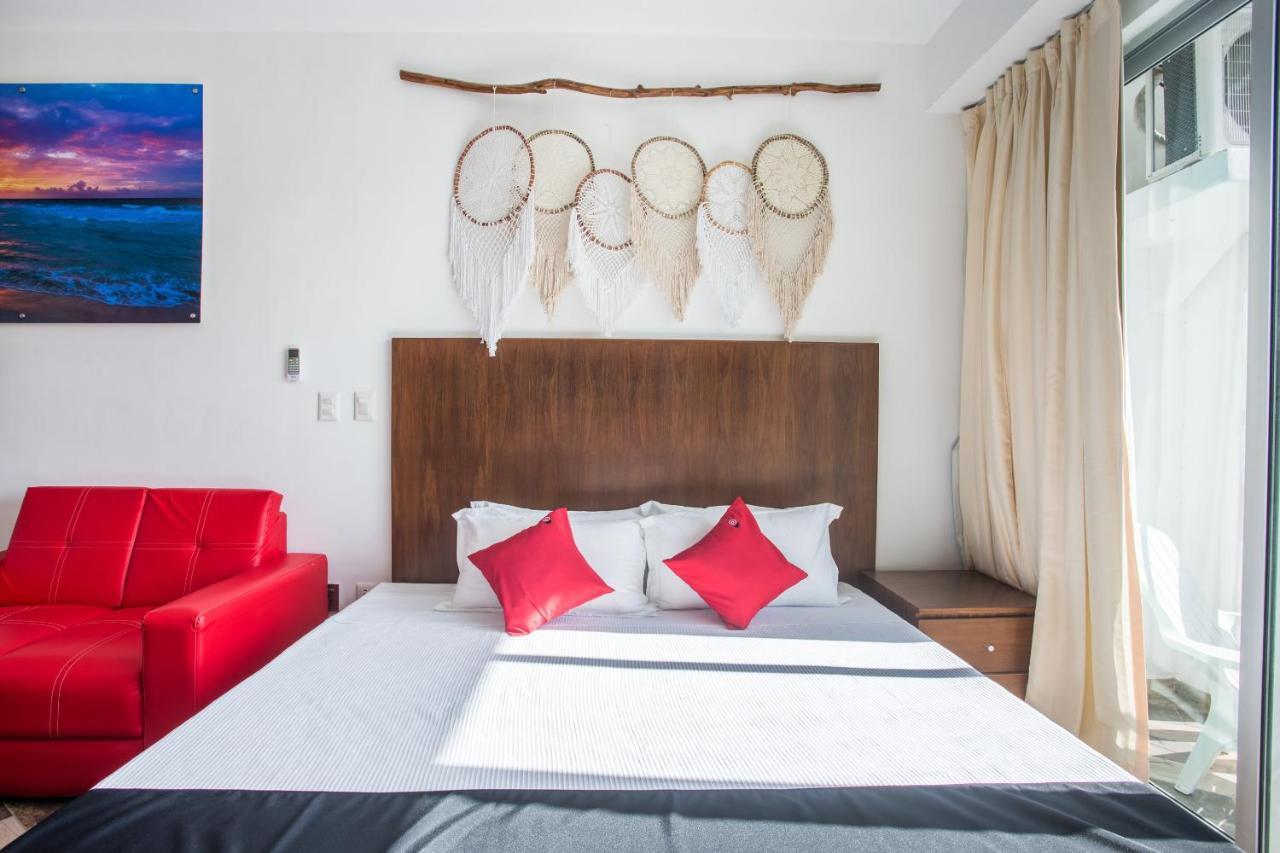 Capital O Cancun Ocean View, كانكون المظهر الخارجي الصورة A bedroom at the hotel