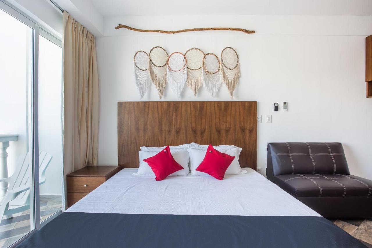 Capital O Cancun Ocean View, كانكون المظهر الخارجي الصورة A bedroom at the hotel
