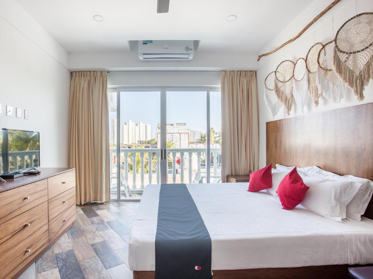 Capital O Cancun Ocean View, كانكون المظهر الخارجي الصورة A bedroom at the hotel